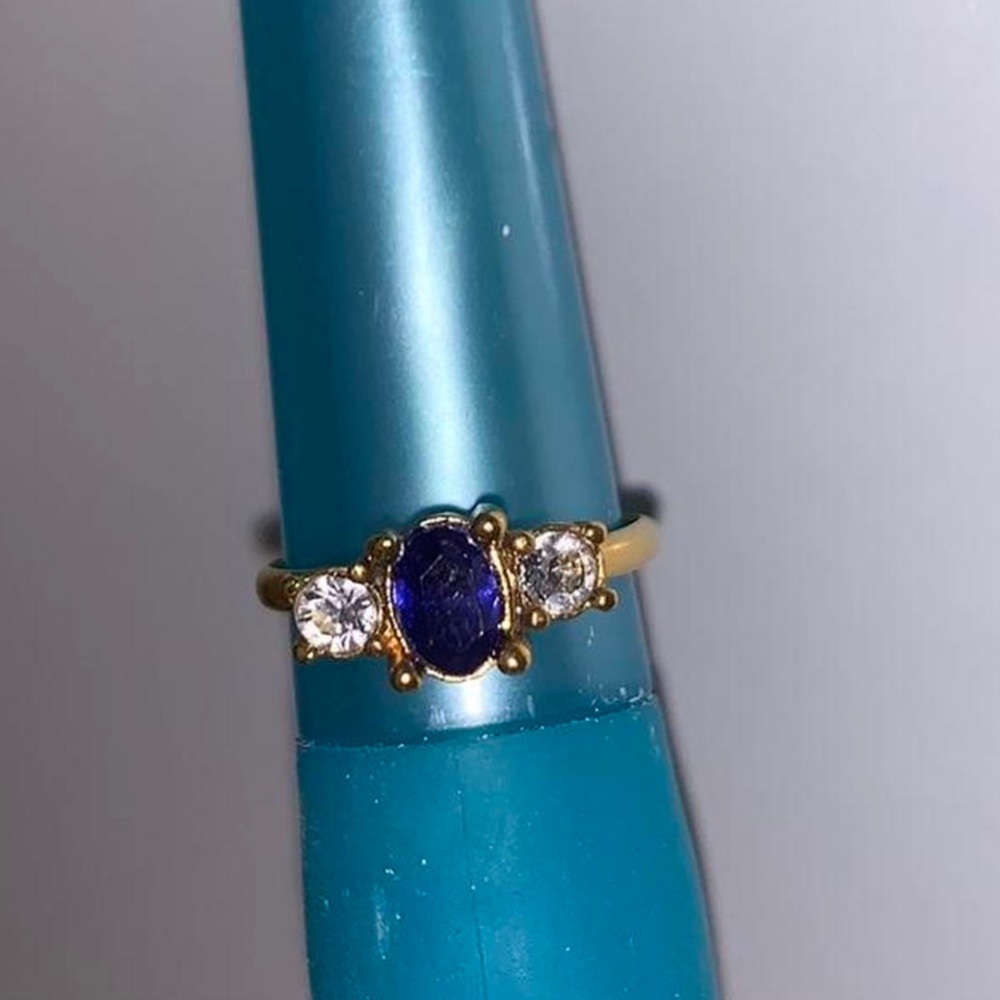 Small adjustable sapphire and diamond ring